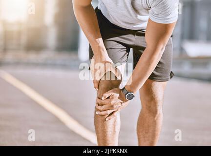Runner training accident with joint pain, arthritis and tendon problems. Health, fitness and a sports injury with athlete man suffering from a Stock Photo