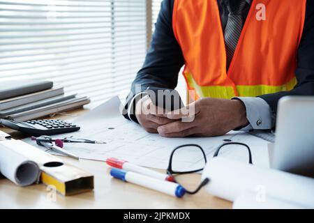 Cropped image of architect texting to colleague when working on project Stock Photo