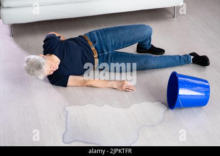 Slip And Fall Accident. Wet Floor Water Spill Stock Photo