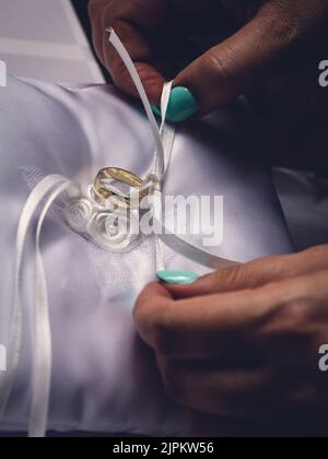 Wedding rings on pillow Stock Photo