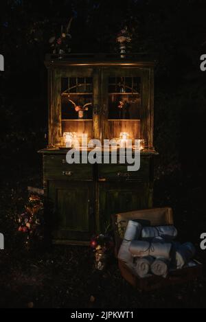 An old drawer with lighten candles Stock Photo