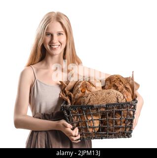 Young woman holding basket with fresh bread on white background Stock Photo