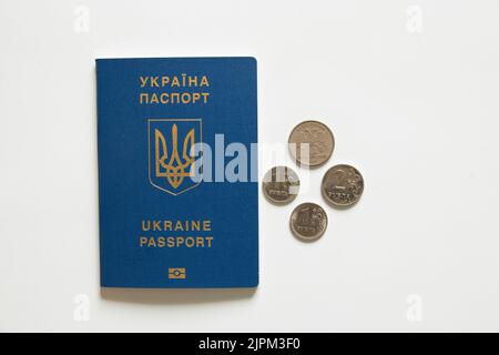 Foreign Ukrainian passport and Russian rubles lie nearby on a white background, economy and tourism, sanctions in Russia 2022 Stock Photo