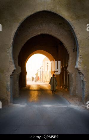 A vertical shot of walking in street of Meknes