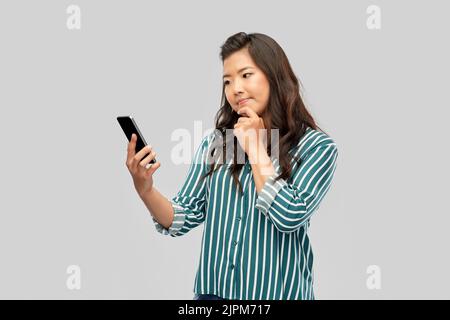 asian woman using smartphone Stock Photo