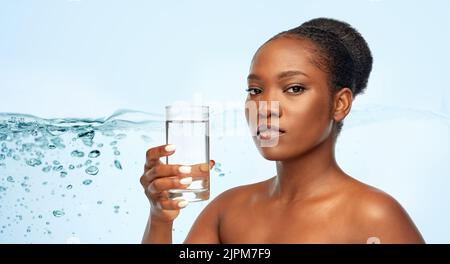 young african american woman with glass of water Stock Photo