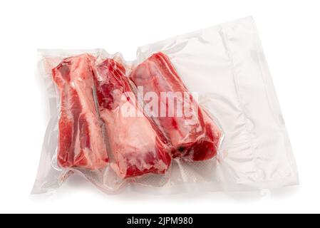 Pork ribs in vacuum packed sealed for sous vide cooking on white background in top view Stock Photo