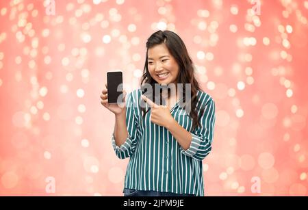 happy asian woman over grey background Stock Photo