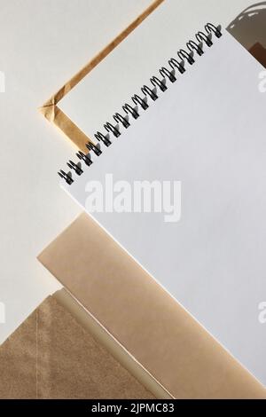 Flatlay of Office Stationery, Notebooks and Envelopes on White Background. Minimal Design Mockup with Copy Space. Stock Photo