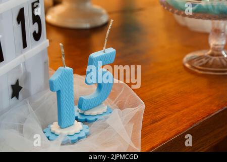 Pink party cake, 15th birthday, with blue number fifteen, 15 year old birthday cake Stock Photo