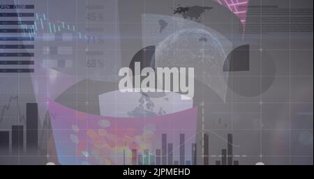 Image of statistics and data processing over screens Stock Photo