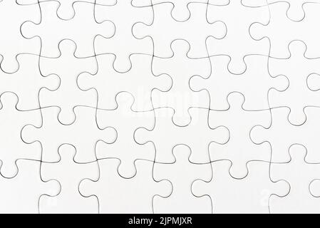 close-up view of plain white jigsaw puzzle background Stock Photo