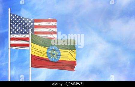 Waving American flag and flag of Ethiopia. Stock Photo