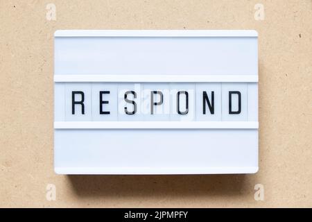 Lightbox with word respond on wood background Stock Photo