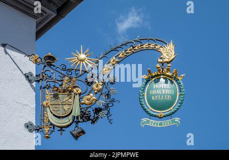 Miltenberg, Germany - July 18, 2021: Detail of the old commercial sign of an  hotel in the Main street, Stock Photo