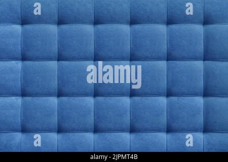 Blue suede leather background for the wall in the room. Interior design, headboards made of furniture fabric, furniture upholstery. Classic checkered Stock Photo