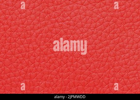 Natural, artificial red leather texture background. Material for sport items, clothes, furnitre and interior design. ecological friendly leatherette. Stock Photo