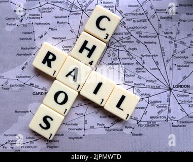 Rail chaos caused by delays, cancellations, strikes and industrial action, across the British train transport network - RMT, ASLEF in Scrabble letters Stock Photo