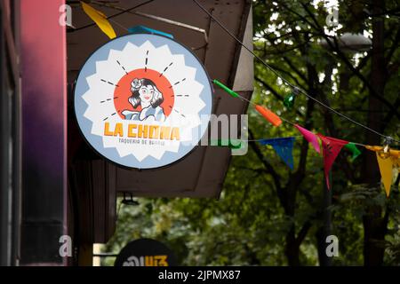 Belgrade-Serbia - May 28, 2022: Entrance outdoor restaurant round sign board in Dorcol - area full of bars and restaurants to go out for food and drin Stock Photo