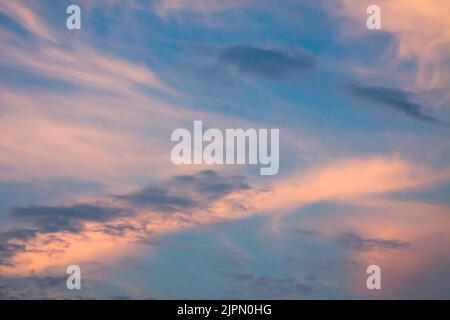 Sky background, deep blue, pink, orange and purple tones with white clouds texture. HD background, 4k wallpaper suitable for PC, tablet or mobile phon Stock Photo