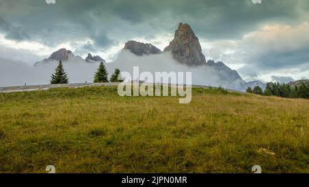 Beatifuil view of Italian Alps with dramatic clouds in the sky, Dolomites Dolomiti, Italy, Europe. HD wallpaper, 4k Green background. Stock Photo