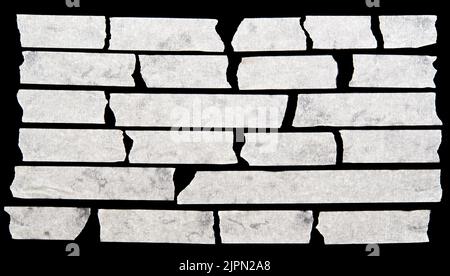 Adhesive tape pieces on black background Stock Photo