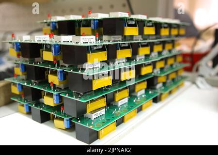 Electrical boards with parts for manual assembly of an electrical device. Digital indication. Manual assembly of radio components.. Stock Photo