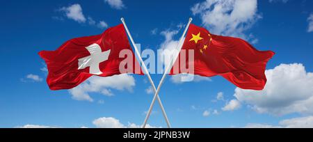 two crossed flags china and Switzerland waving in wind at cloudy sky. Concept of relationship, dialog, travelling between two countries. 3d illustrati Stock Photo