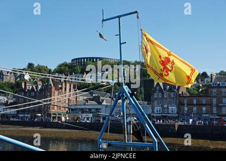 Lion Rampant unofficial Scottish flag flying from a fishing boat's mast in Oban Harbour, Argyll and Bute, Scotland Stock Photo