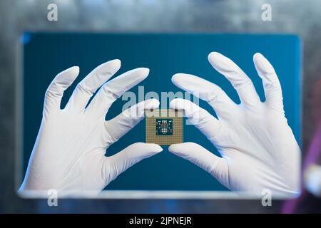 Central processing unit in hands of electronic engineer Stock Photo