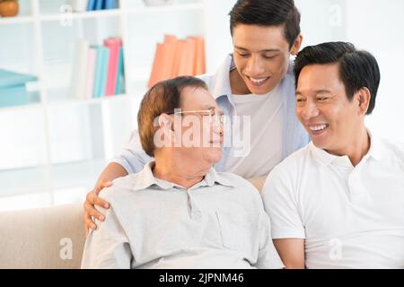 Cheerful family member spending time together at home Stock Photo