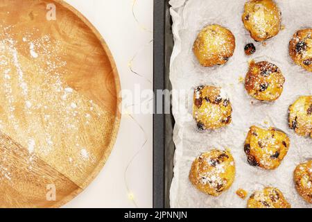 Eco friendly food banner with hande made natural sweet pastry on a baking sheet with wooden plate on a white background with copy space. Home made coo Stock Photo