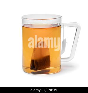 Glass cup with tea and a tea bag isolated on white background Stock Photo