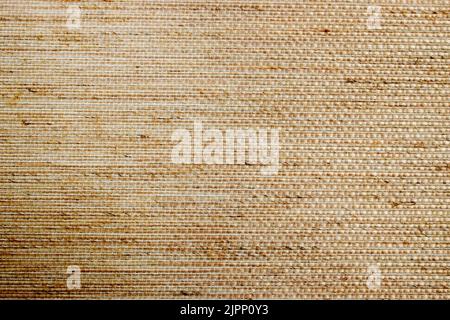 Textile pastel background with abstract weaving of threads. Fabric tufted multi-colored background. Stock Photo