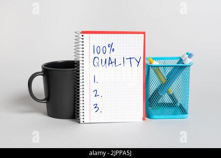 Conceptual caption 100 Quality, Word for Guaranteed pure and no harmful chemicals Top Excellence Cup, Notebook With Important Message And Pencil Case Stock Photo