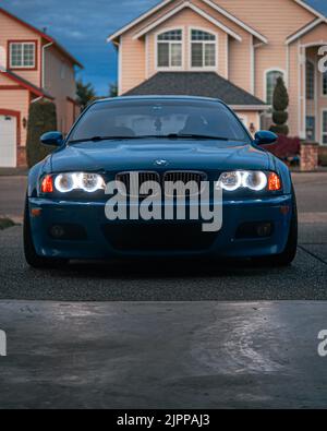 The M Power BMW 2003 M3 Laguna Seca Blue parked in a yard Stock Photo