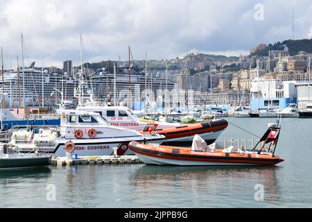 GENOA, ITALY - AUGUST 15, 2022: Boats and vessels of the Italian coast guard at the old port (Porto Antico) in Genoa. Stock Photo