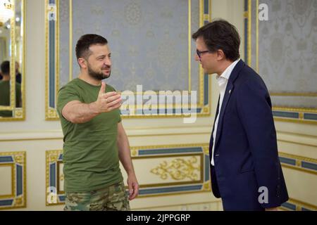 Kyiv, Ukraine. 19th Aug, 2022. Ukrainian President Volodymyr Zelenskyy, left, welcomes the Mayor of Florence, Italy, Dario Nardella, right, before the start of a meeting with representatives of Eurocities at the Mariinsky Palace, August 19, 2022 in Kyiv, Ukraine. Credit: Ukrainian Presidential Press Office/Ukraine Presidency/Alamy Live News Stock Photo