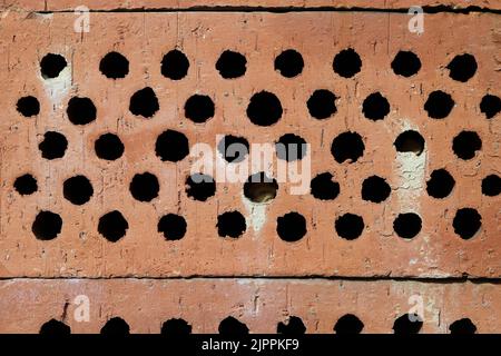 Texture of orangish red tiles during a sunny summer day. Close up color image. Perfect as a background. Stock Photo