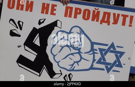 JERUSALEM, ISRAEL - AUGUST 19: Placard condemning Ukraine with comparisons to Nazis is seen during a pro-Russia rally held by members of the Russian Jewish community in Israel outside Prime Minister's official residence on August 19, 2022 in Jerusalem, Israel. Though Israel has not provided Ukraine with military support, Israeli government has angered Russia by tilting to Ukraine particularly connected with Israel's caretaker Prime Minister Yair Lapid condemning Russia’s military actions in Ukraine. Credit: Eddie Gerald/Alamy Live News Stock Photo