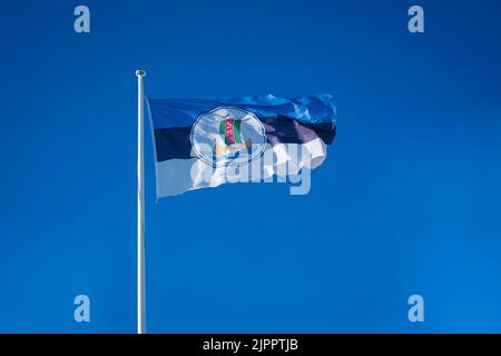 Flag of Saaremaa Merispordi Selts (English: The Saaremaa Sea Sports Society). The SMS society promotes sailing among children and young people. Stock Photo