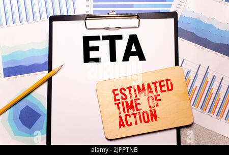 text estimated time of action on wooden block Stock Photo