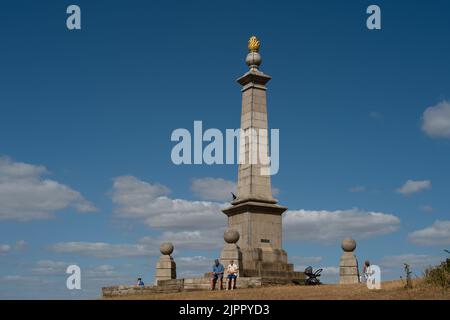 Coombe Hill, Buckinghamshire, UK. 19th August, 2022. People take in the views from Coombe Hill at Butler's Cross today on another warm but windy day as the ongoing drought continues. Credit: Maureen McLean/Alamy Live News Stock Photo