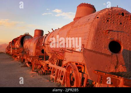 The Uyuni train cemetery at sunset, Potosi, Bolivia. Stock Photo