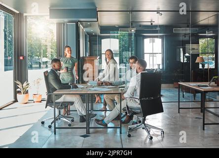 Corporate business meeting, team collaboration and strategy planning in a startup company. Office workers, diversity employees and workforce having Stock Photo