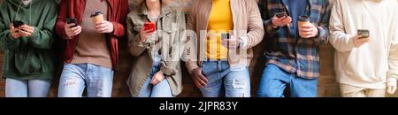 Multiracial friends group using smartphones to sharing content on social networks. Technology lifestyle concept - Selective focus Stock Photo