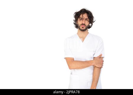 Portrait of a young male nurse in a white uniform isolated on white background - Healthcare concept Stock Photo