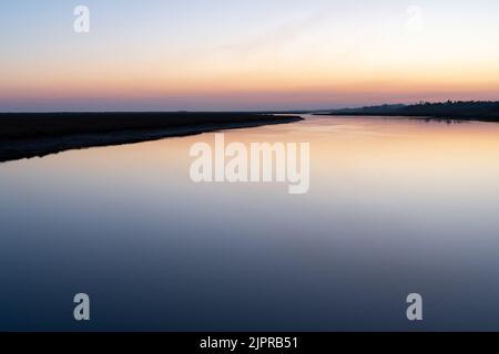calm waters of Ria Formosa at sunset in Algarve, Portugal Stock Photo