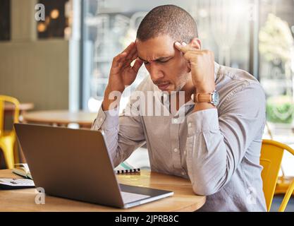 Work, anxiety and a stress headache, man on a computer at his office desk. Employee having a burnout and working, thinking about debt or a deadline Stock Photo