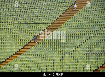 Munich, Germany. 19th Aug, 2022. Athletics: European Championships, Olympic Stadium, spectators walk down the stairs to the seats in light rain. Credit: Soeren Stache/dpa/Alamy Live News Stock Photo